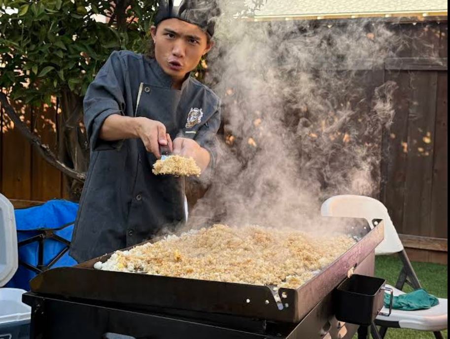 A tiny laptop in the palm of a hand